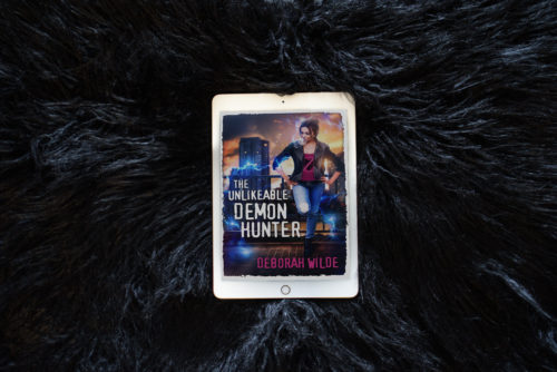 Kindle cover of The Unlikeable Demon Hunter by Deborah Wilde on a black fur background.